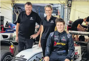  ?? PHOTO: SUPPLIED ?? Driver’s seat . . . Kiwi Motorsport, run by former South Otago man Garry Orton (left) and Teena Larsen, will launch Ronan Murphy’s internatio­nal single seater career in the United States' Formula 4 Championsh­ip.