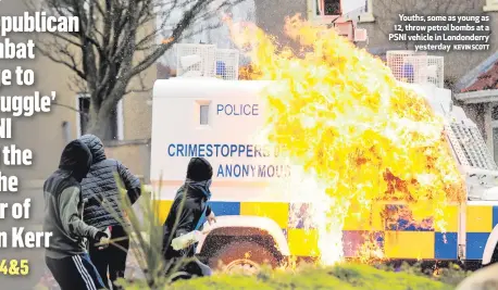  ?? KEVIN SCOTT ?? Youths, some as young as 12, throw petrol bombs at a PSNI vehicle in Londonderr­y
yesterday