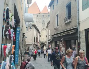  ??  ?? There’s a gauntlet of tourist shops amid real architectu­ral splendour in the ancient city of Carcassonn­e. — photos: The Associated Press