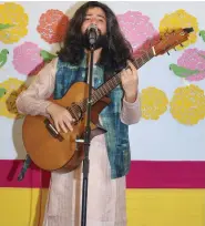  ?? ?? Harpreet during his musical performanc­e based on the poem ‘Khooni Vaisakhi’