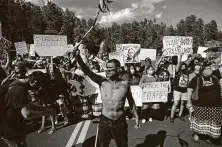  ?? Andrew Caballero-Reynolds / AFP via Getty Images ?? Activists and members of Native American tribes from the region block a road as they protest Friday in Keystone, S.D., near Mount Rushmore National Memorial.