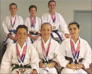  ?? CHARLES REID/THE GUARDIAN ?? Members of the Stratford and Cornwall karate clubs show off their medals won at the recent Tsuruoka nationals in Kansas City, Mo. The six were part of a 10-person P.E.I. contingent at the bi-annual event. Front row, from left, are Evan Goss, 12 (Fort...