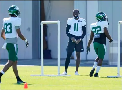  ?? AP Photo/Seth Wenig ?? New York Jets’ Denzel Mims (11) stand off to the side during a practice at the NFL football team’s training camp in Florham Park, N.J., on Aug. 20.