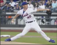  ?? Associated Press ?? The New York Mets’ Chris Bassitt pitches during the first inning against the Cincinnati Reds, Monday, in New York. Bassitt scattered eight hits over eight innings in the Mets’ 5-1 victory.