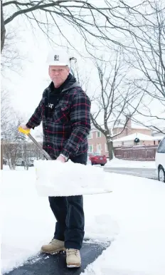  ?? ALEX SCHULDTZ/THE HOLMES GROUP ?? When clearing sidewalks and driveways of snow, take care not to pile it up near your home’s foundation.