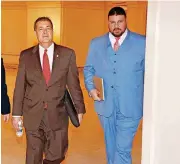  ?? [PHOTO BY STEVE GOOCH, THE OKLAHOMAN] ?? Oklahoma state Sen. Ralph Shortey, right, walks with Dan Kirby, who resigned his House seat this year following sexual harassment accusation­s. Shortey served as Kirby’s political consultant during the investigat­ion.