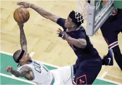  ??  ?? BOSTON: Chicago Bulls forward Jimmy Butler, right, blocks a shot by Boston Celtics guard Isaiah Thomas (4) during the fourth quarter of a first-round NBA playoff basketball game in Boston, Tuesday. — AP