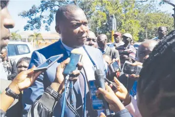  ??  ?? FILE PHOTO: Copperbelt Minister Bowman Lusambo talks to the media