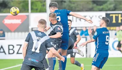  ?? ?? Morgyn Neill heads in the last-minute winner for Cove against Airdrieoni­ans