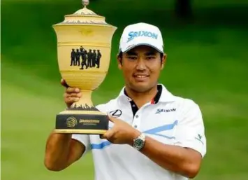  ?? (AP Photo/Tony Dejak) ?? Hideki Matsuyama, from Japan, holds up The Gary Player Cup trophy after the final round of the Bridgeston­e Invitation­al golf tournament at Firestone Country Club, Sunday, Aug. 6, 2017, in Akron, Ohio. Matsuyama finished the tournament at 16-under par.