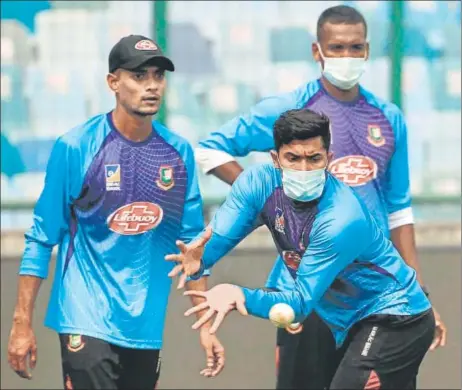  ?? AFP ?? Bangladesh's Soumya Sarkar wears a face mask during their practice session at Arun Jaitley Cricket Stadium in New Delhi on Friday.