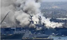  ?? ?? Smoke rises from the USS Bonhomme Richard at Naval Base San Diego after an explosion and fire in July 2020. Photograph: Denis Poroy/AP