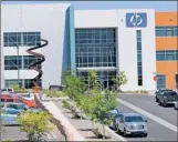  ?? JIM THOMPSON/JOURNAL ?? Hewlett-Packard pledged to have 1,350 employees by year’s end at this Rio Rancho facility.