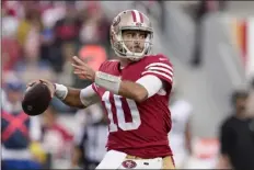  ?? GODOFREDO A. VÁSQUEZ — THE ASSOCIATED PRESS FILE ?? San Francisco 49ers quarterbac­k Jimmy Garoppolo (10) passes against the New Orleans Saints during the second half of an NFL football game on Nov. 27, 2022, in Santa Clara, Calif. Garoppolo has agreed to a three-year, $67.5 million contract with the Las Vegas Raiders, according to a person with knowledge of the deal. The person spoke on condition of anonymity because the deal can’t be announced until Wednesday, March 15, 2023.