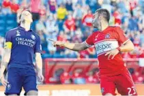  ?? MIKE DINOVO/USA TODAY SPORTS ?? Lions’ defender Jonathan Spector shows his frustratio­n after the Fire’s Nemanja Nikolic scores a goal in the second half of Sunday’s match.