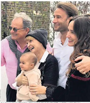  ??  ?? Dame Tessa Jowell on her 70th birthday with her grand-daughter, husband David Mills, son Matthew and daughter Jess