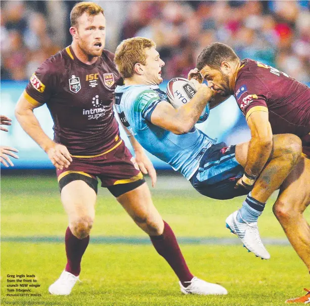  ?? Pictures: GETTY IMAGES ?? Greg Inglis leads from the front to crunch NSW winger Tom Trbojevic.