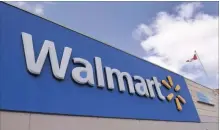  ?? RYAN REMIORZ THE CANADIAN PRESS ?? Walmart is reporting better-than-expected profit and revenue for the first quarter with rebounding online sales.