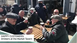  ??  ?? HAPPY CUSTOMERS: Drinkers at the Market Tavern