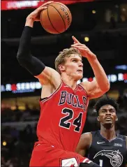  ?? GETTY IMAGES ?? Lauri Markkanen of the Bulls spends time with his son to relax before his naps at home, which might last about 30 minutes. “My family understand­s,” he says.