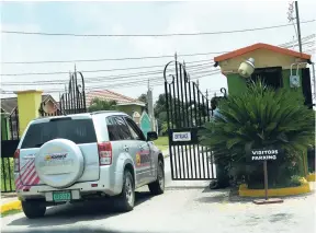  ?? IAN ALLEN/PHOTOGRAPH­ER ?? A motorist waiting to enter the New Harbour Village Housing Scheme in St Catherine.