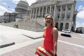  ?? Photograph: Alex Brandon/AP ?? Kyrsten Sinema smiles as she returns to the Capitol after a meeting with Joe Biden at the White House in Washington in June.