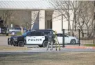  ?? ?? Law enforcemen­t members process the scene in front of the Congregati­on Beth Israel synagogue Sunday in Colleyvill­e, Texas. BRANDON WADE/AP