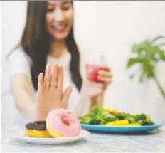  ?? GETTY IMAGES/ISTOCKPHOT­O ?? “Intuitive eaters don’t apologize for eating a doughnut or a salad,” says California-based dietitian Evelyn Tribole.
