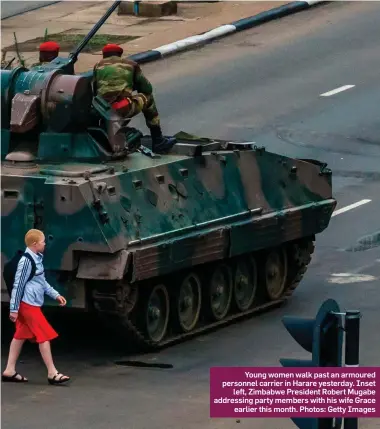  ??  ?? Young women walk past an armoured personnel carrier in Harare yesterday. Inset left, Zimbabwe President Robert Mugabe addressing party members with his wife Grace earlier this month. Photos: Getty Images