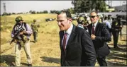  ?? JANSSEN / ASSOCIATED PRESS BRAM ?? Just 11 days ago, Brett McGurk (center) said it would be “reckless” to consider the Islamic State defeated.