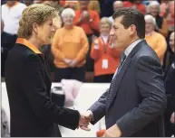  ?? Associated Press file photo ?? Tennessee coach Pat Summitt, left, shakes hands with UConn coach Geno Auriemma before a 2006 game in Knoxville, Tenn.