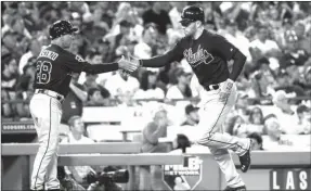  ?? JAE C. HONG / The Associated Press ?? Atlanta's Freddie Freeman (right) rounds third base after hitting a home run in a recent game against the Los Angeles Dodgers.