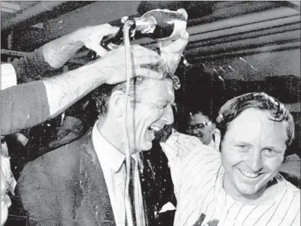  ?? Associated Press ?? OUTFIELDER ROD GASPAR pours champagne on New York Mayor John Lindsay after the Mets beat the Atlanta Braves to win the 1969 National League pennant on the way to an improbable World Series victory over the Baltimore Orioles.