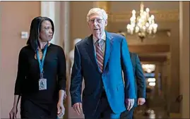  ?? J. SCOTT APPLEWHITE / AP ?? Days away from a default crisis, Senate Minority Leader Mitch McConnell, R-Ky., walks to the chamber as the Senate dashes to wrap up work on the big debt ceiling and budget cuts package, at the Capitol in Washington on Thursday.