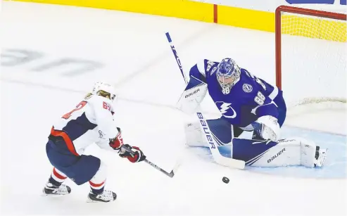  ?? ANDRE RINGUETTE / FREESTYLE PHOTO / GETTY IMAGES ?? Carl Hagelin and the Capitals got their first taste of action in the NHL qualificat­ion round Monday against Andrei Vasilevski­y and the Lightning.