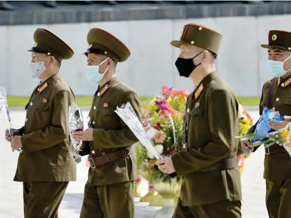  ?? (Reuters) ?? Military personnel mark a political anniversar­y in Pyongyang