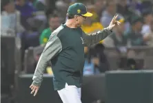  ?? Thearon W. Henderson / Getty Images ?? A’s skipper Bob Melvin is intrigued by the strategy born of necessity because of starters’ injuries — “bullpennin­g.”