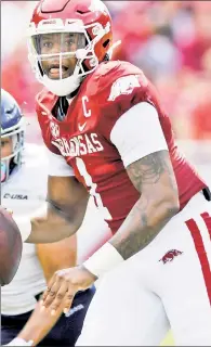  ?? AP ?? BIG THREAT: Dual-threat Arkansas quarterbac­k KJ Jefferson and the Razorbacks’ physical ground attack could pose problems for Texas on Saturday.