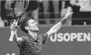  ?? Andres Kudacki / Associated Press ?? Novak Djokovic’s U.S. Open win Sunday gives him 14 Grand Slam titles, tying him with his idol Pete Sampra and moving him into third place behind Roger Federer (20) and Rafael Nadal (17).