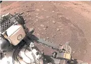  ??  ?? COVERING MARS: Wheel tread marks are left in the soil of Jezero Crater on Mars, as Nasa’s Mars rover Perseveran­ce drives on Martian surface for the first time, on Thursday.