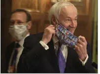  ?? (Arkansas Democrat-Gazette/Staton Breidentha­l) ?? Gov. Asa Hutchinson wears a Star Wars-themed face mask as he arrives Monday for his daily covid-19 briefing at the state Capitol in Little Rock. More photos at arkansason­line.com/55governor/.