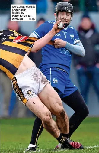  ?? INPHO ?? Get a grip: Martin Keoghan is fouled by Waterford’s Ian O’Regan