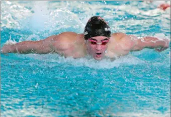  ?? SARAH GORDON/THE DAY ?? At the ECC championsh­ip meet March 3 at UConn Avery Point, Fitch’s John Marcolina turned in a dominant performanc­e to earn Swimmer of the Meet honors for the second straight season. Marcolina won the 50- and 100-yard freestyle events, breaking the meet...