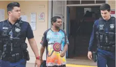  ?? Picture: CAMERON BATES ?? Steven Merton Martin, 45, being led away from the Ingham Magistrate­s Court to serve three months of a nine-month prison sentence for recidivist drink and disqualifi­ed driving.