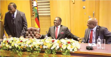  ??  ?? President Emmerson Mnangagwa shares a lighter moment with Chief Secretary to the President and Cabinet Dr Misheck Sibanda (left) and chairman of the Public Service Commission Dr Mariyawand­a Nzuwah at his Munhumutap­a offices during his inaugural meeting...