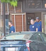  ?? kevin Myrick ?? left: Onlookers waited for glimpses of the stars in front of the Rockmart History Museum during filming of “Irresistib­le” in downtown Rockmart. right: Jon Stewart and crew walk out of one of the storefront­s being used for “Irresistib­le” in downtown Rockmart in preparatio­n for shooting of a scene for the forthcomin­g feature film. Rockmartt is playing host as “Deerlaken, Wisconsin” in the movie.