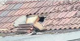  ??  ?? The aftermath of the break-in at the Benarty Community Shop, top, and a hole in the roof where the thieves broke in, above.