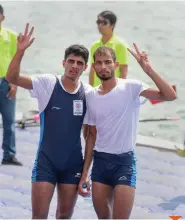  ?? PTI ?? Rowers Rohit Kumar and Bhagwan Singh celebrate after taking bronze in the lightweigh­t men’s double sculls on Friday. —