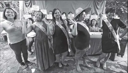  ?? BOY SANTOS ?? Members of the women’s group Gabriela hold their own version of the Miss Universe pageant to dramatize their opposition to the exploitati­on of women, in Quezon City yesterday.