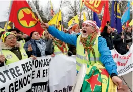 ??  ?? Pro- Kurdish demonstrat­ors protest against Turkish military operations in Afrin, a city located in northern Syria, during a rally in front of the European headquarte­rs of the UN in Geneva on Friday. — APy